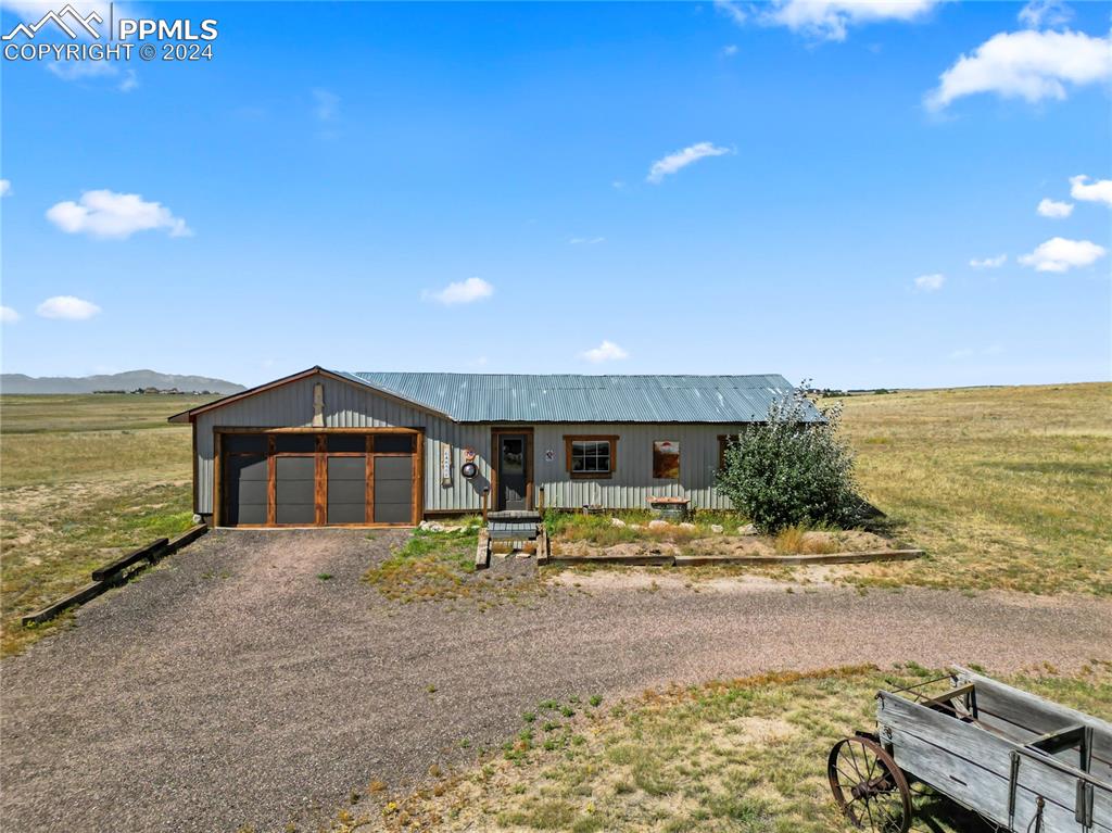 22545 Murphy Road Peyton, CO 80831 - Photo 20 of 30 a view of a house with a yard and ocean view