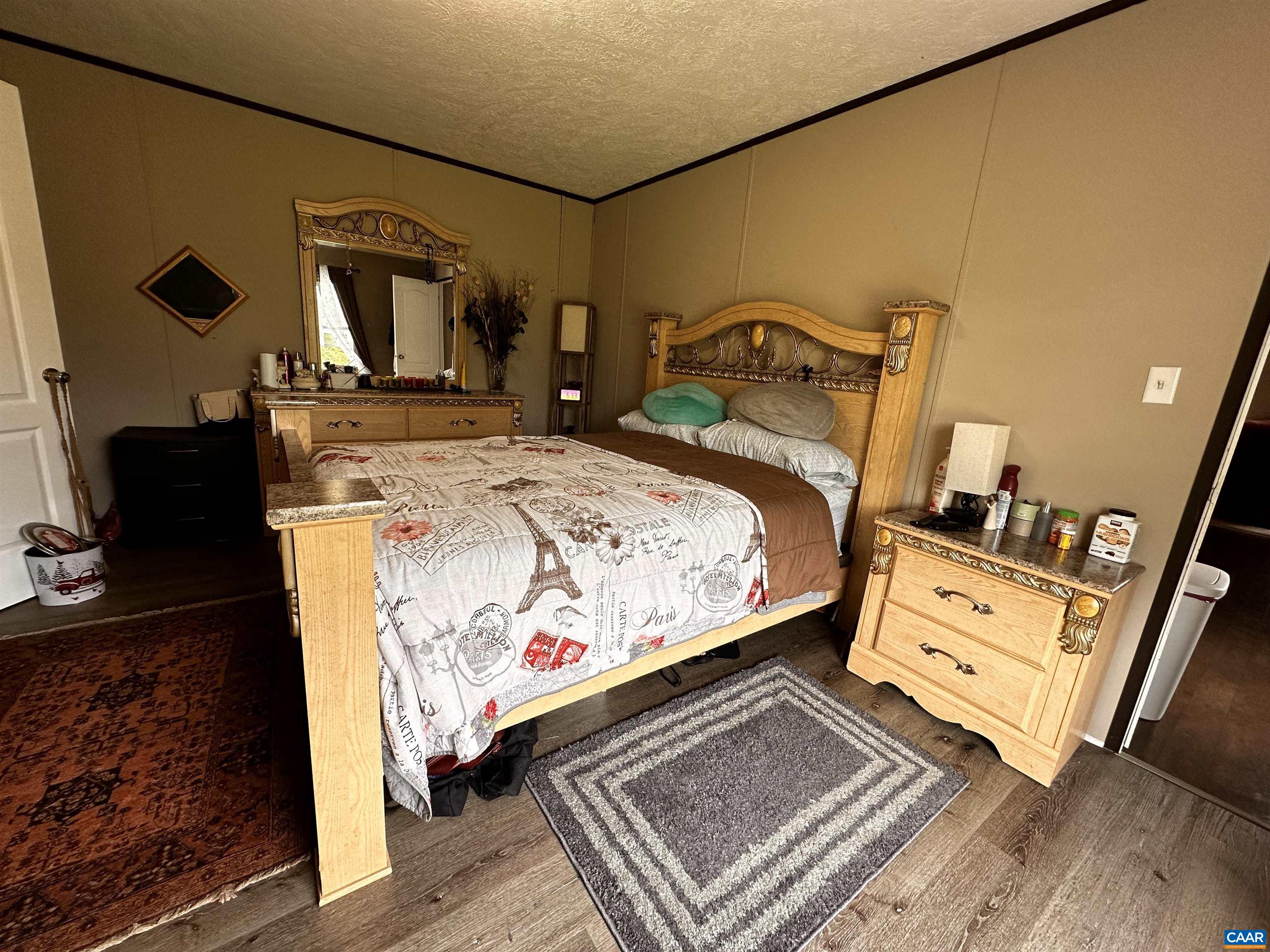 1625 South Constitution Route Dillwyn, VA 23936 - Photo 12 of 30 a bed sitting in a bedroom and mirror