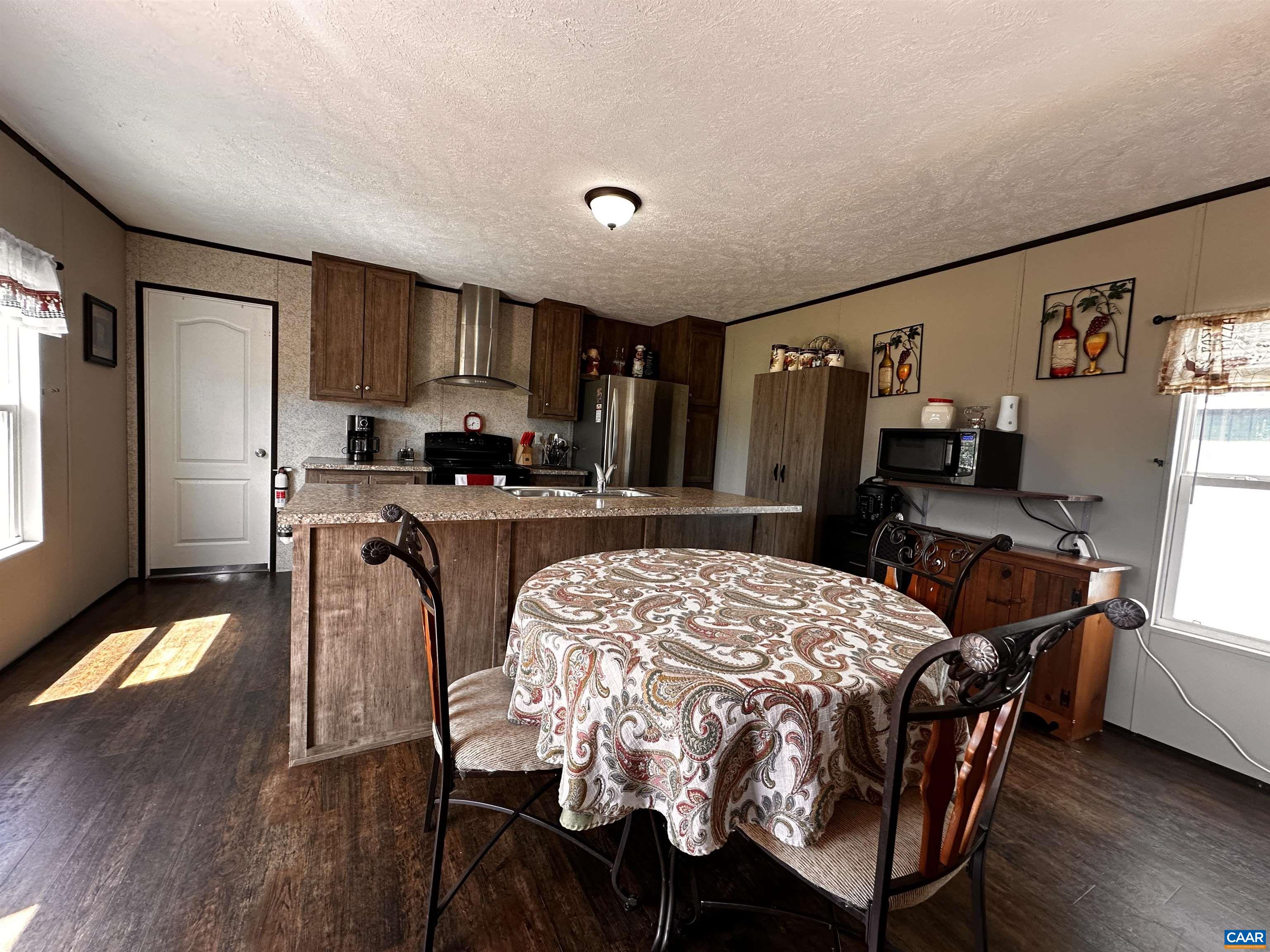 1625 South Constitution Route Dillwyn, VA 23936 - Photo 10 of 30 a view of a dining room with furniture and wooden floor