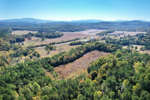 an aerial view of residential house and sandy dunes