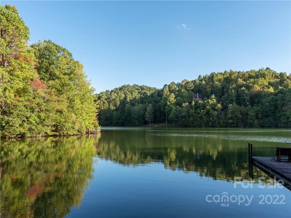 0 Line Runner Ridge Road Rosman, NC 28772 - Photo 11 of 13 a view of a lake with a yard and large trees