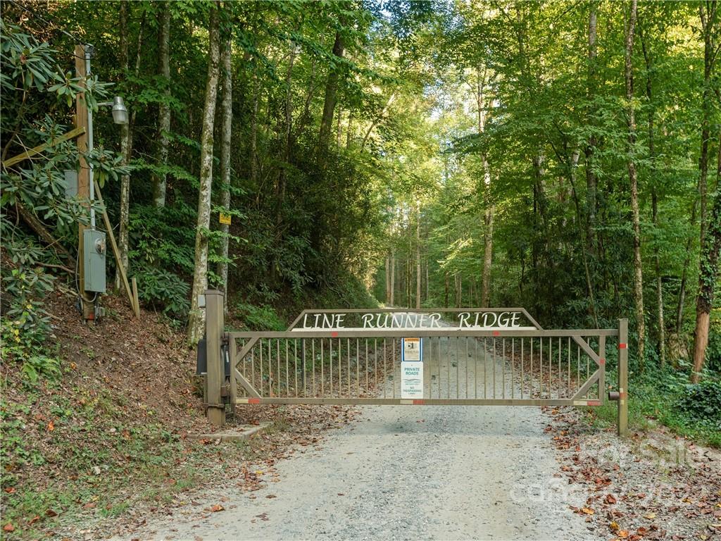 0 Line Runner Ridge Road Rosman, NC 28772 - Photo 5 of 13 a view of a yard with a small deck