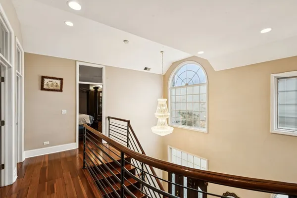 a living room with furniture a glass table and a couch