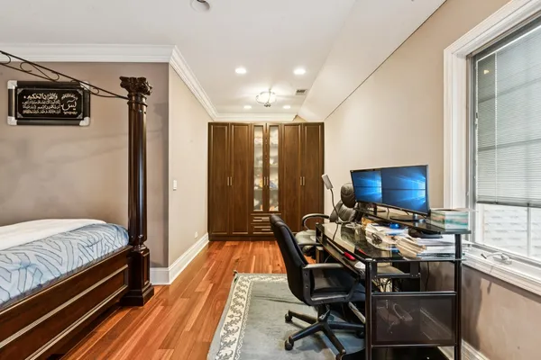 a bedroom with furniture and a tv