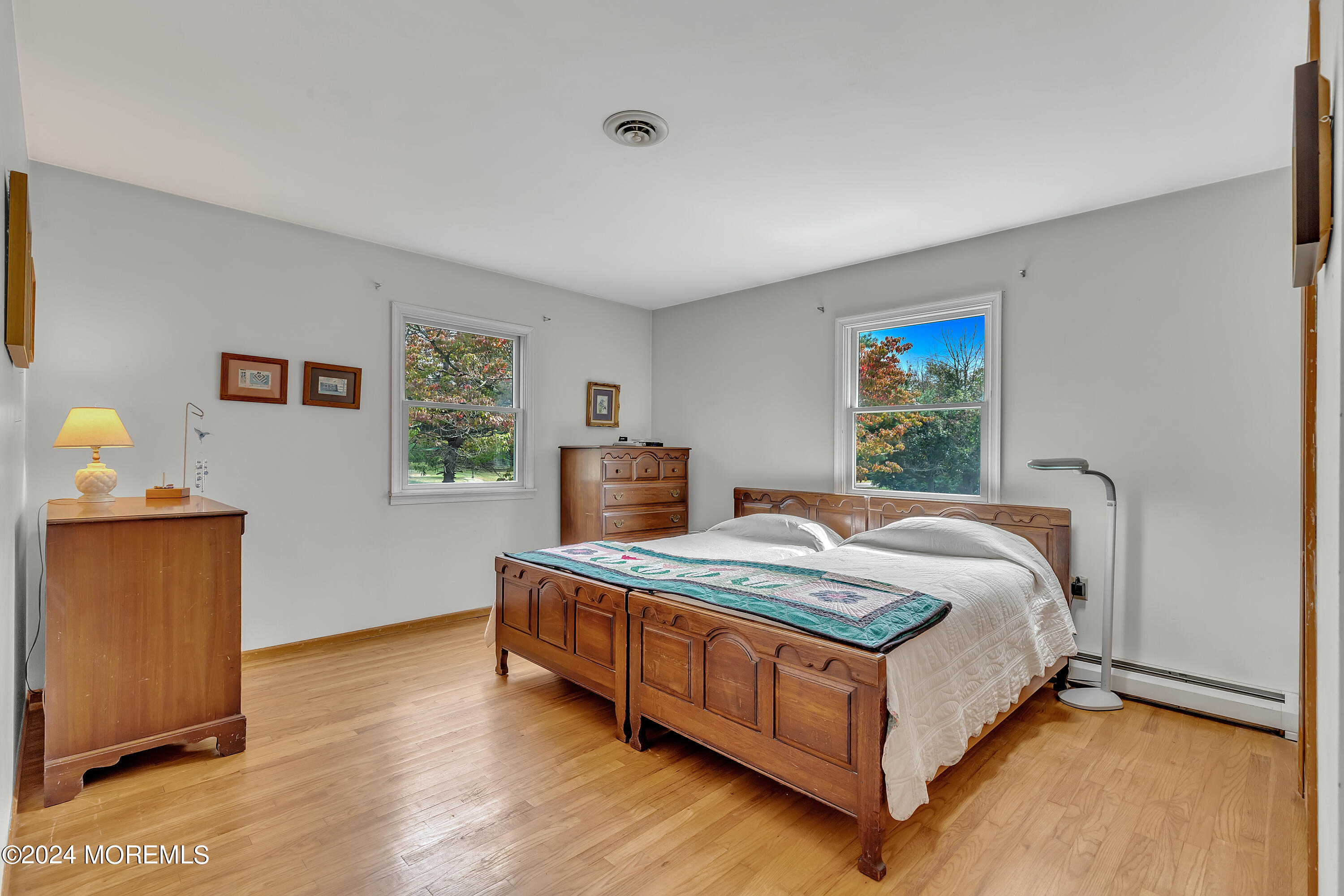 271 Route 539 Cream Ridge Cream Ridge, NJ 08514 - Photo 23 of 36 a bed sitting in a spacious bedroom next to a window