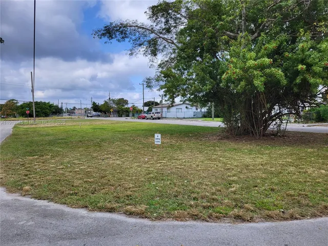 a view of a water fountain and a big yard