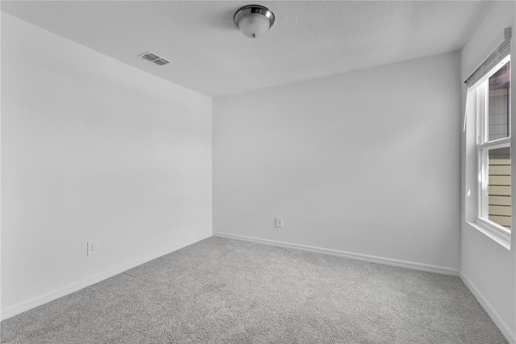 4367 Ranch House Road St. Cloud, FL 34772 - Photo 12 of 29 a view of an empty room and a window