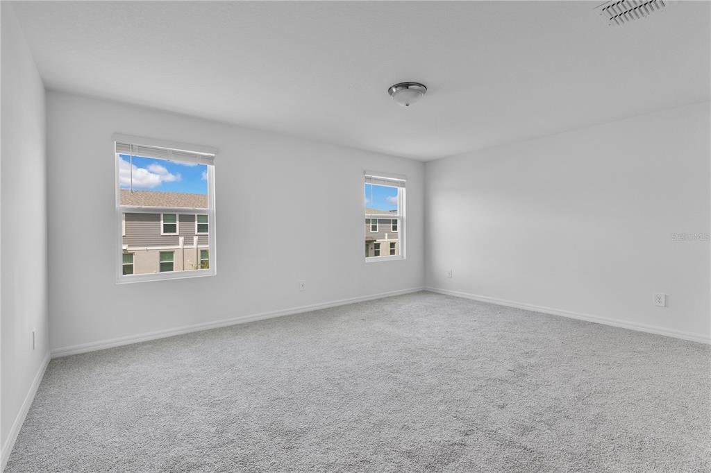 4367 Ranch House Road St. Cloud, FL 34772 - Photo 13 of 29 an empty room with windows