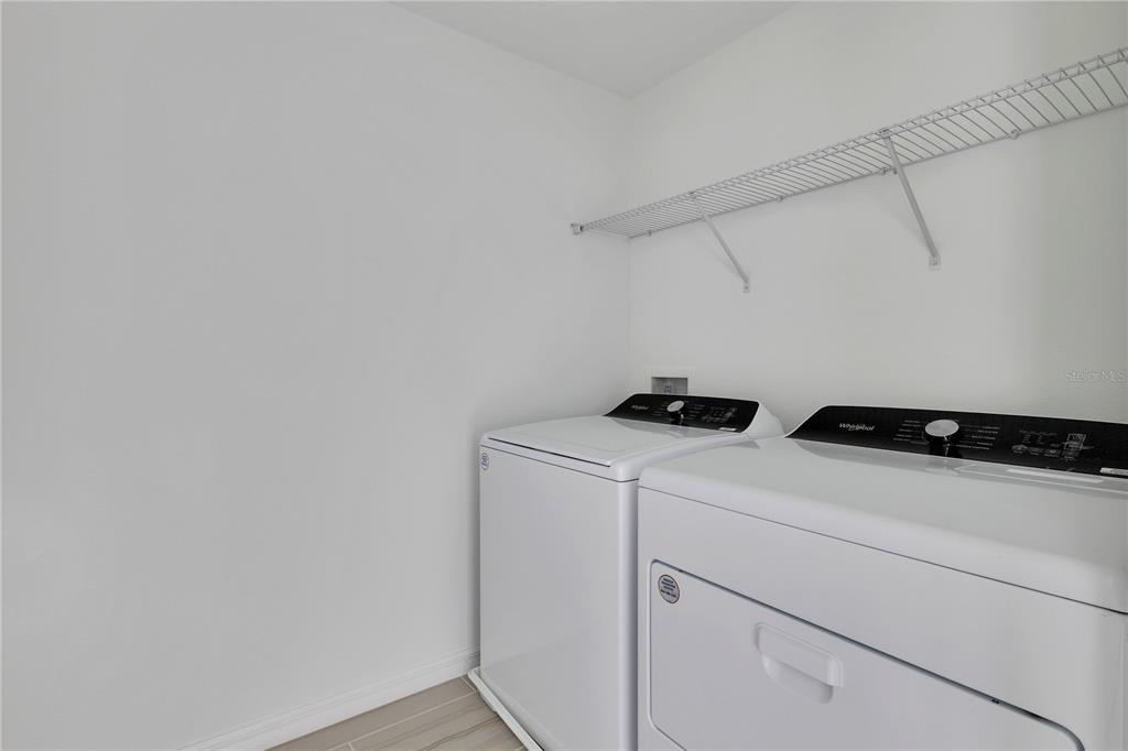 4367 Ranch House Road St. Cloud, FL 34772 - Photo 16 of 29 a utility room with dryer and washer