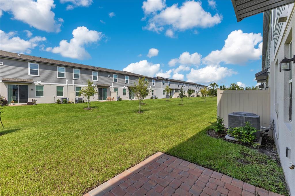 4367 Ranch House Road St. Cloud, FL 34772 - Photo 17 of 29 a view of a house with a big yard