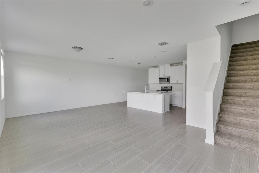 4367 Ranch House Road St. Cloud, FL 34772 - Photo 3 of 29 a view of a kitchen with white cabinets and white appliances