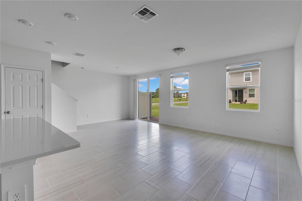 4367 Ranch House Road St. Cloud, FL 34772 - Photo 4 of 29 a view of an empty room with window and wooden floor