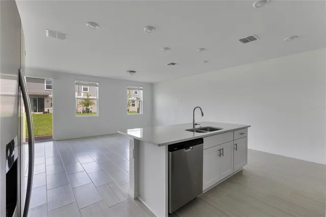 a kitchen with a sink and cabinets
