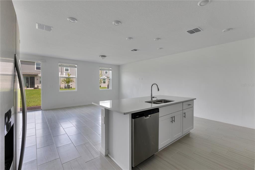 4367 Ranch House Road St. Cloud, FL 34772 - Photo 7 of 29 a kitchen with a sink and cabinets