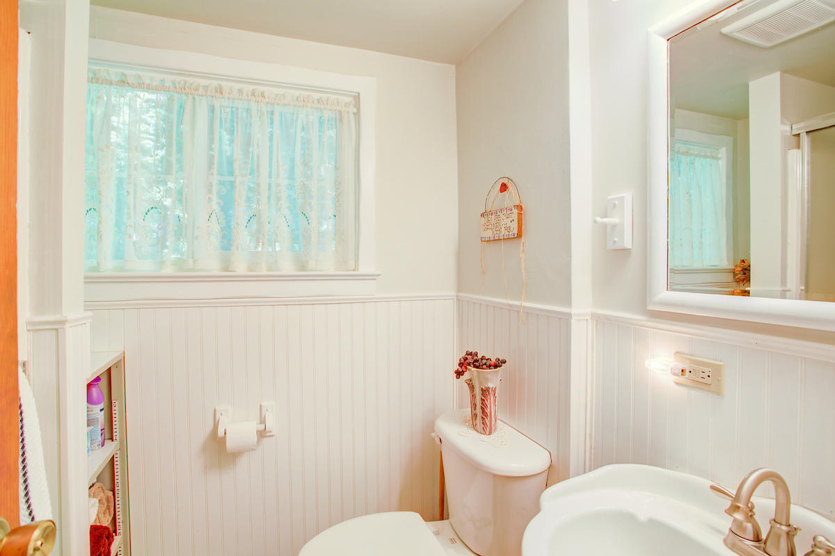 3184 Old Stage Road Central Point, OR 97502 - Photo 18 of 31 a white toilet sitting next to a bathroom sink