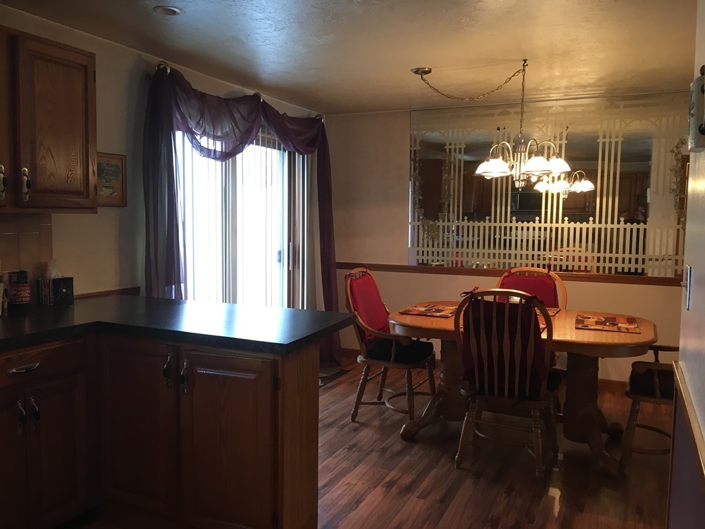 3 Highcrest Park, Unit 3 Webster, MA 01570 - Photo 3 of 14 a view of a dining room with furniture and window