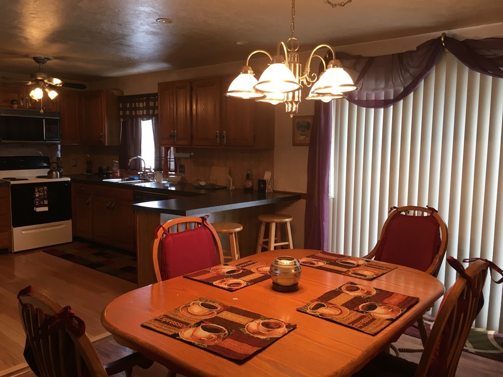 3 Highcrest Park, Unit 3 Webster, MA 01570 - Photo 4 of 14 a kitchen with a table and chairs in it