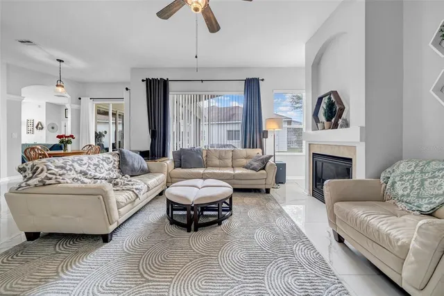 a bedroom with a bed and ceiling fan