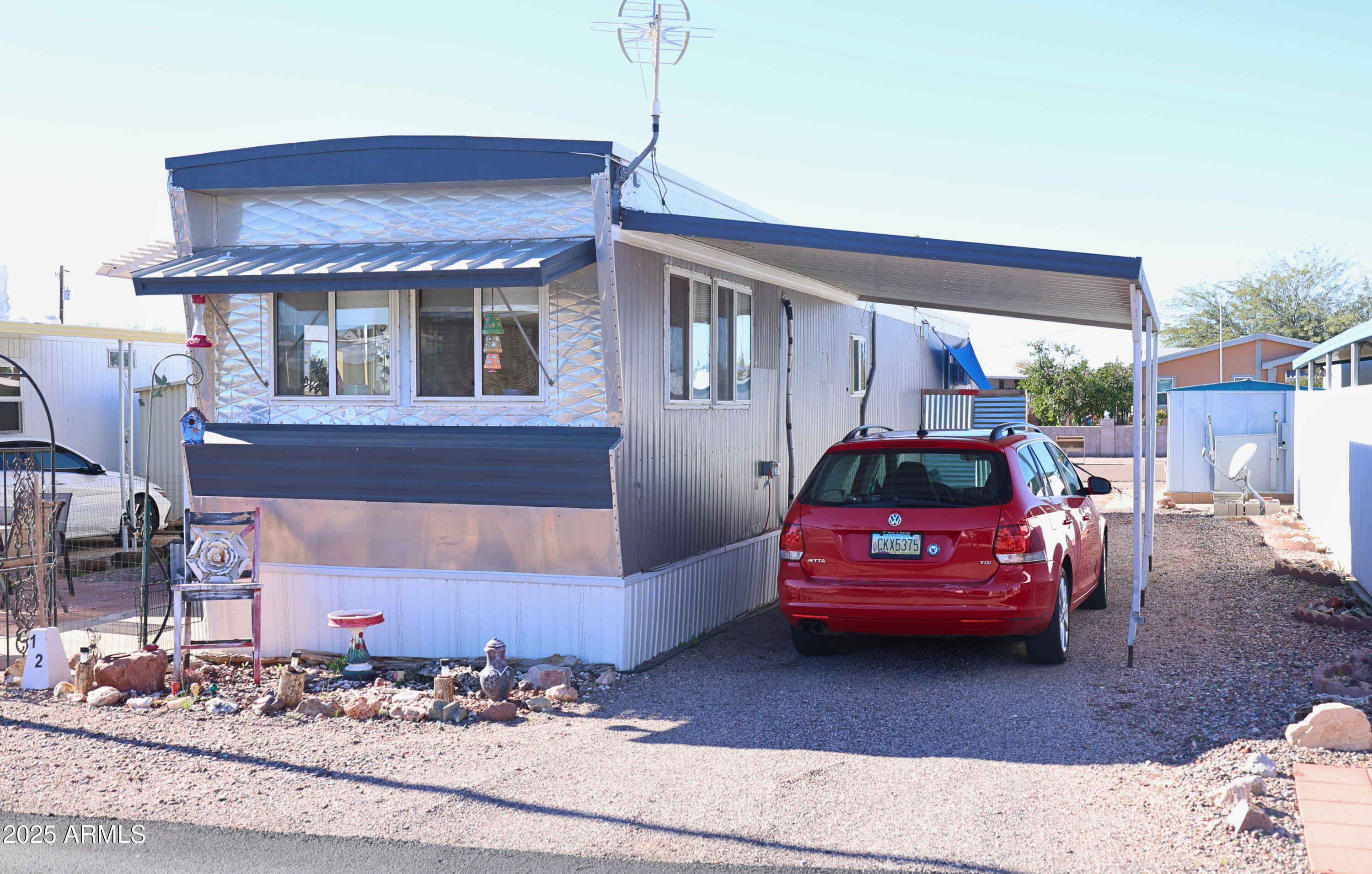 2015 South Wickiup Road, Unit 12 Apache Junction, AZ 85119 - Photo 2 of 12 a car parked in front of a house