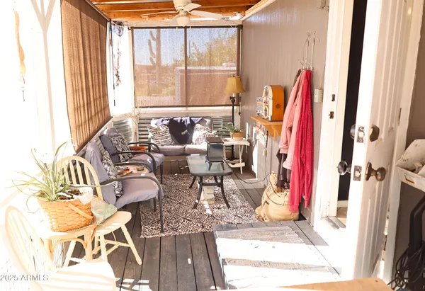 a view of a living room with a couch and a window
