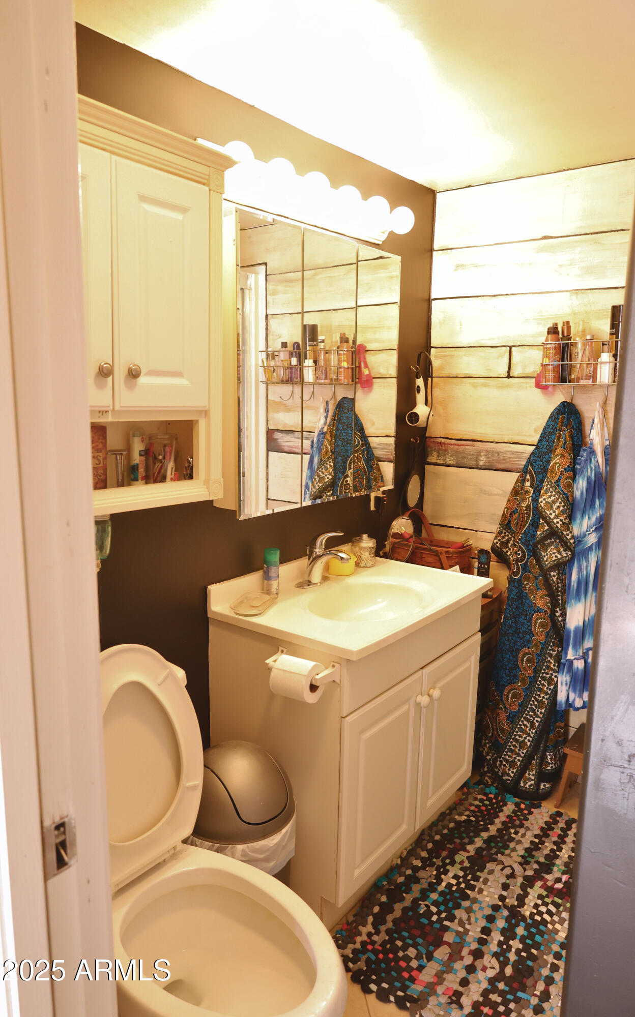 2015 South Wickiup Road, Unit 12 Apache Junction, AZ 85119 - Photo 8 of 12 a bathroom with a toilet sink and mirror