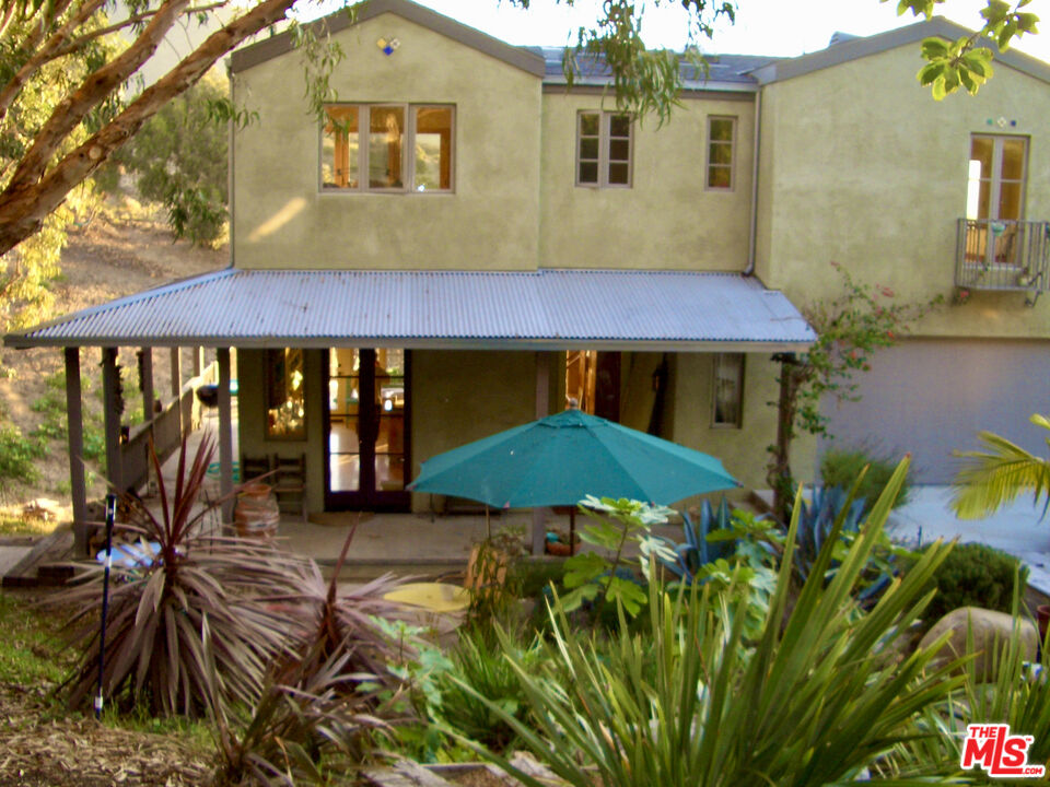 Calpine Drive Malibu, CA 90265 - Photo 3 of 10 a view of a house with a yard