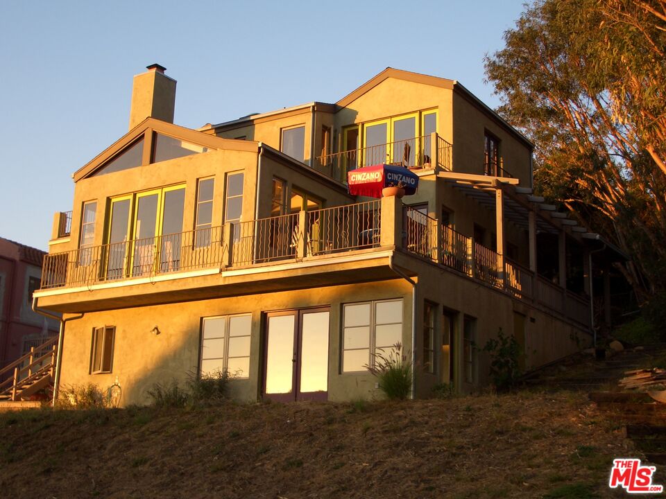 Calpine Drive Malibu, CA 90265 - Photo 5 of 10 a front view of a house with a yard