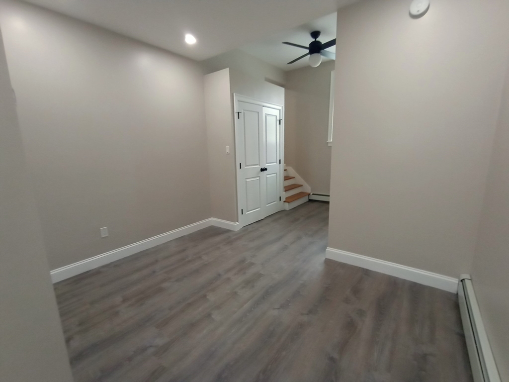 95 Cottage Street, Unit A Boston, MA 02128 - Photo 5 of 18 wooden floor in an empty room