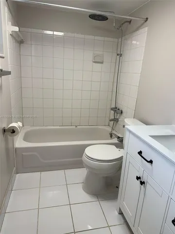 a bathroom with a bathtub a toilet and a shower