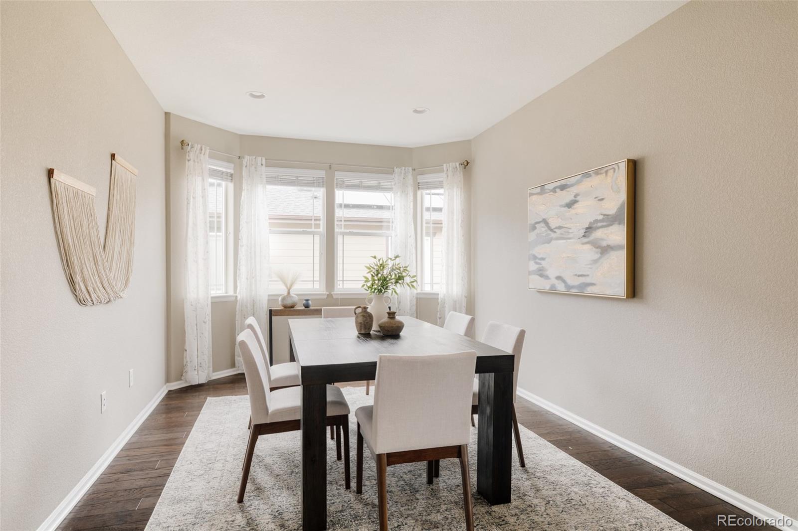 220 South Ider Way Aurora, CO 80018 - Photo 11 of 28 a dining room with furniture and window