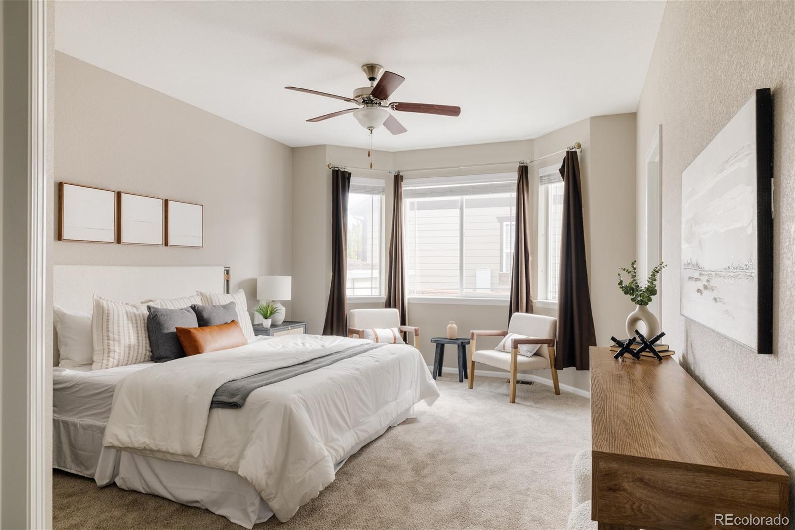 220 South Ider Way Aurora, CO 80018 - Photo 12 of 28 a bedroom with a large bed and a large window