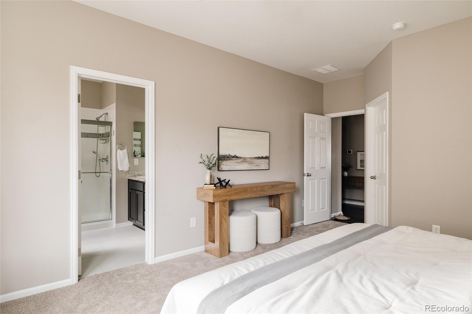 220 South Ider Way Aurora, CO 80018 - Photo 14 of 28 a bedroom with a bed and a mirror