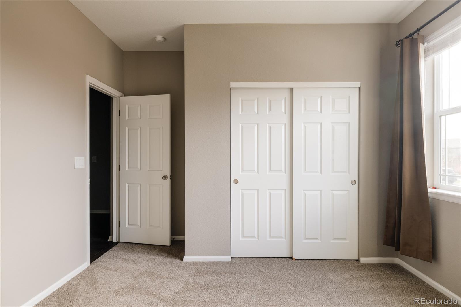 220 South Ider Way Aurora, CO 80018 - Photo 17 of 28 an empty room with window