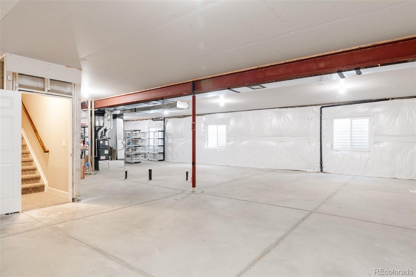 220 South Ider Way Aurora, CO 80018 - Photo 22 of 28 a view of an empty room with stairs