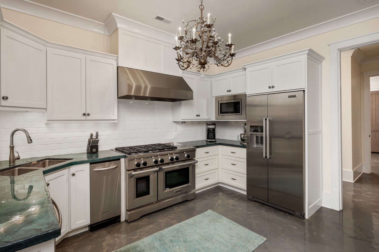 3377 Bailey Road Franklin, TN 37064 - Photo 19 of 49 a kitchen with stainless steel appliances a sink stove and refrigerator