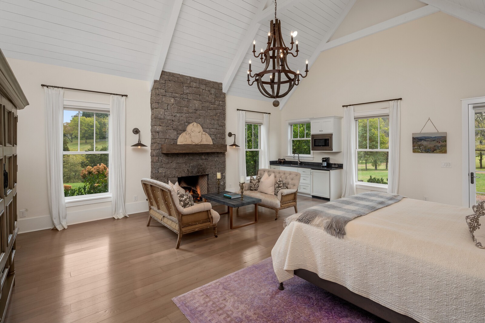 3377 Bailey Road Franklin, TN 37064 - Photo 9 of 49 a bedroom with furniture a fireplace and wooden floor