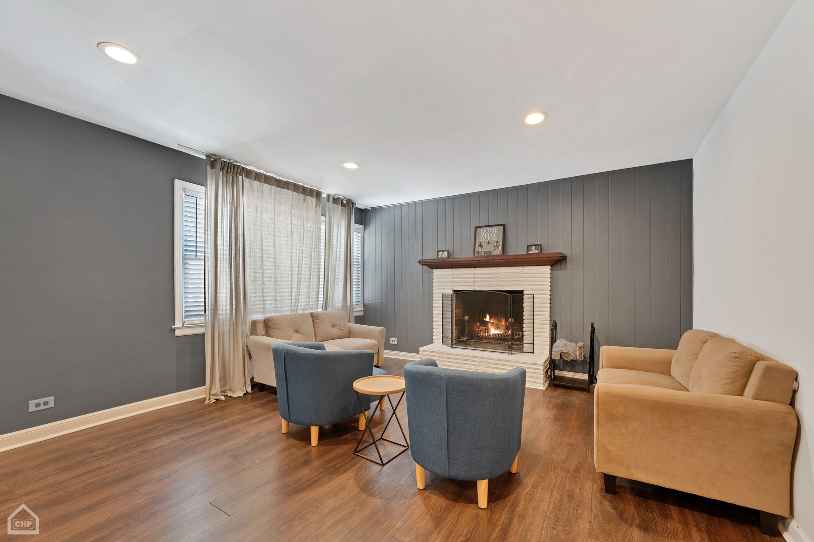 8912 Forestview Road, Unit 2 Evanston, IL 60203 - Photo 2 of 9 a living room with furniture and a fireplace