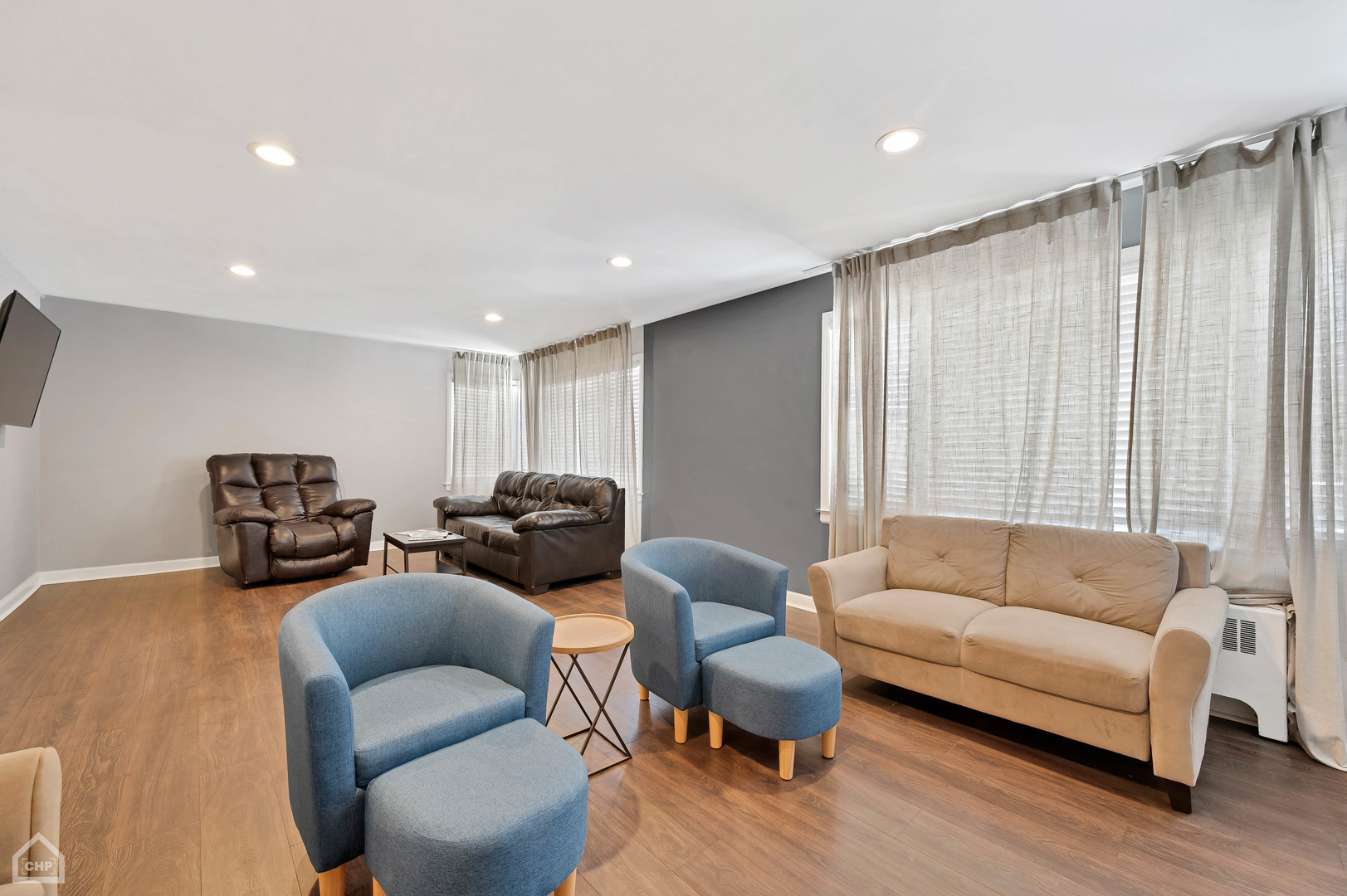 8912 Forestview Road, Unit 2 Evanston, IL 60203 - Photo 3 of 9 a living room with furniture and a large window
