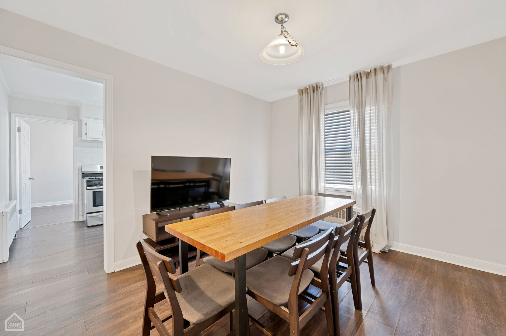 8912 Forestview Road, Unit 2 Evanston, IL 60203 - Photo 6 of 9 a view of a dining room with furniture and wooden floor