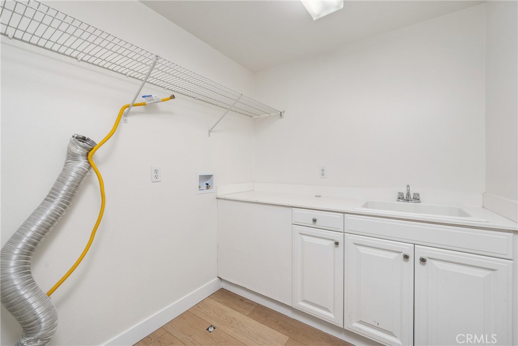 312 Quail Ridge Irvine, CA 92603 - Photo 13 of 21 a view of a storage & utility room with a sink