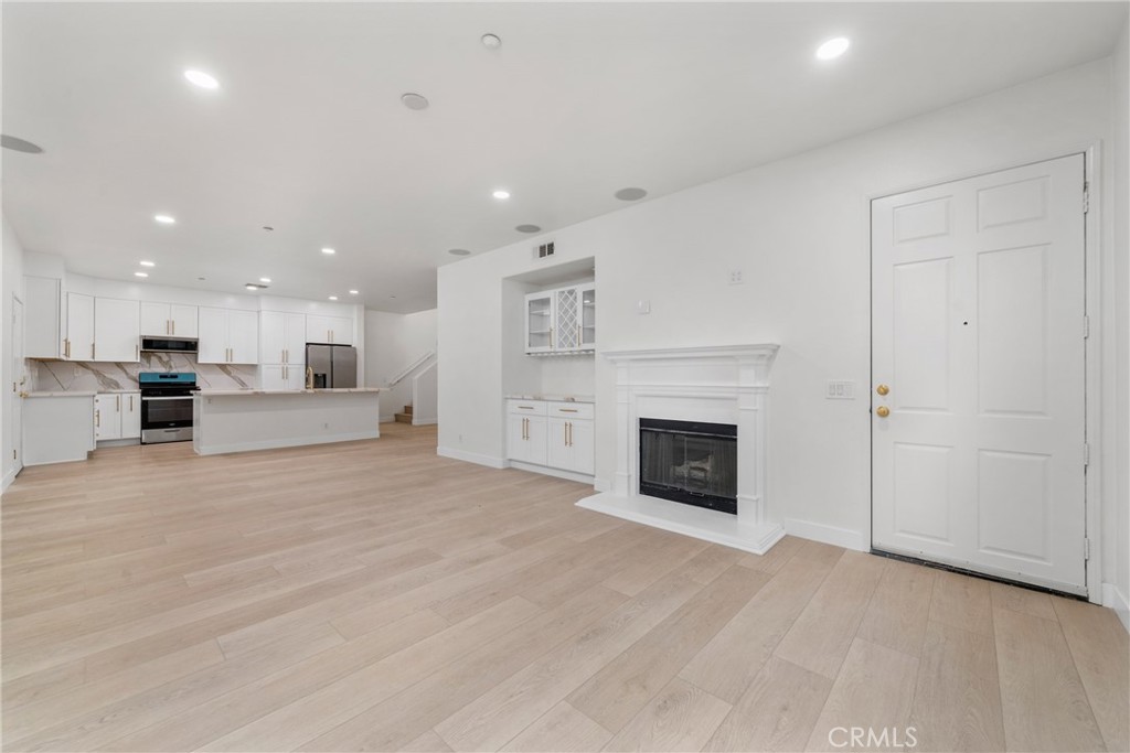 312 Quail Ridge Irvine, CA 92603 - Photo 9 of 21 a view of kitchen and a fireplace