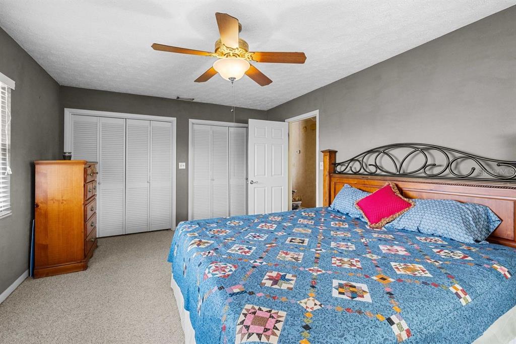 38730 Mickler Road Dade City, FL 33523 - Photo 14 of 38 a bedroom with a bed and dresser