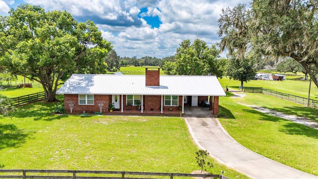 38730 Mickler Road Dade City, FL 33523 - Photo 2 of 38 swimming pool view with a outdoor seating