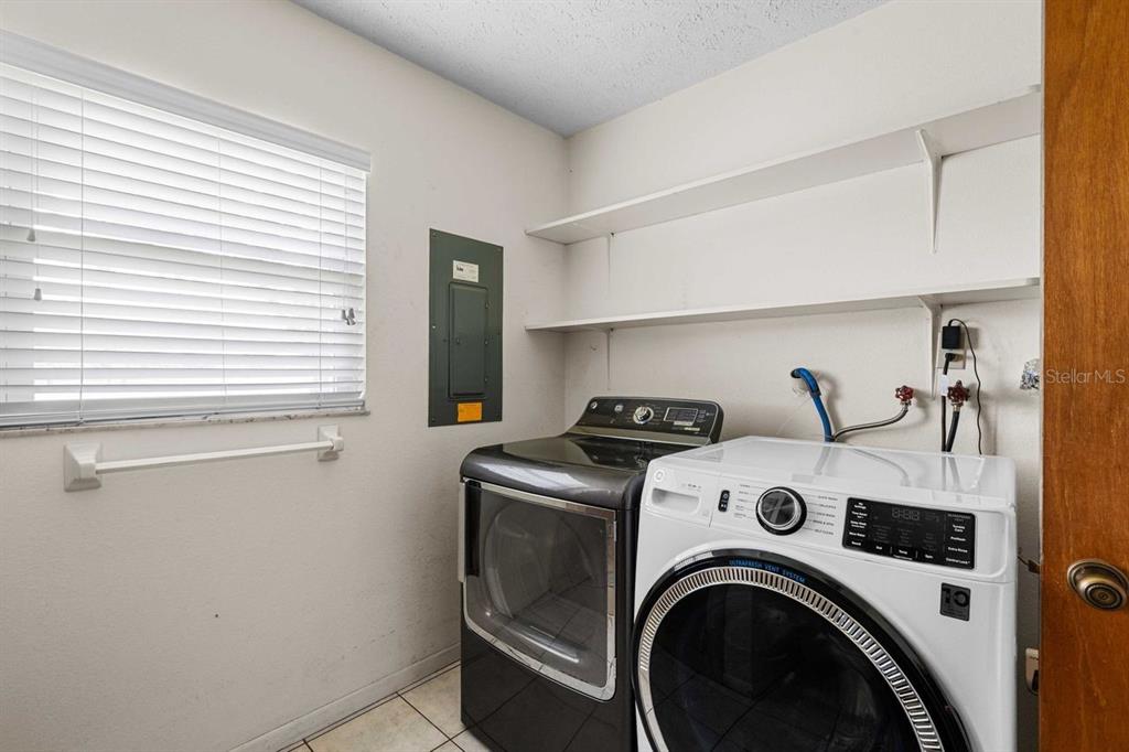 38730 Mickler Road Dade City, FL 33523 - Photo 21 of 38 a utility room with dryer and washer