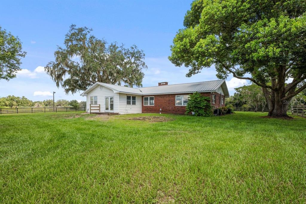 38730 Mickler Road Dade City, FL 33523 - Photo 22 of 38 a front view of a house with garden