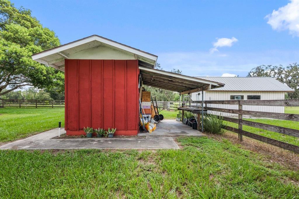 38730 Mickler Road Dade City, FL 33523 - Photo 25 of 38 a view of a backyard with a garden and entertaining space