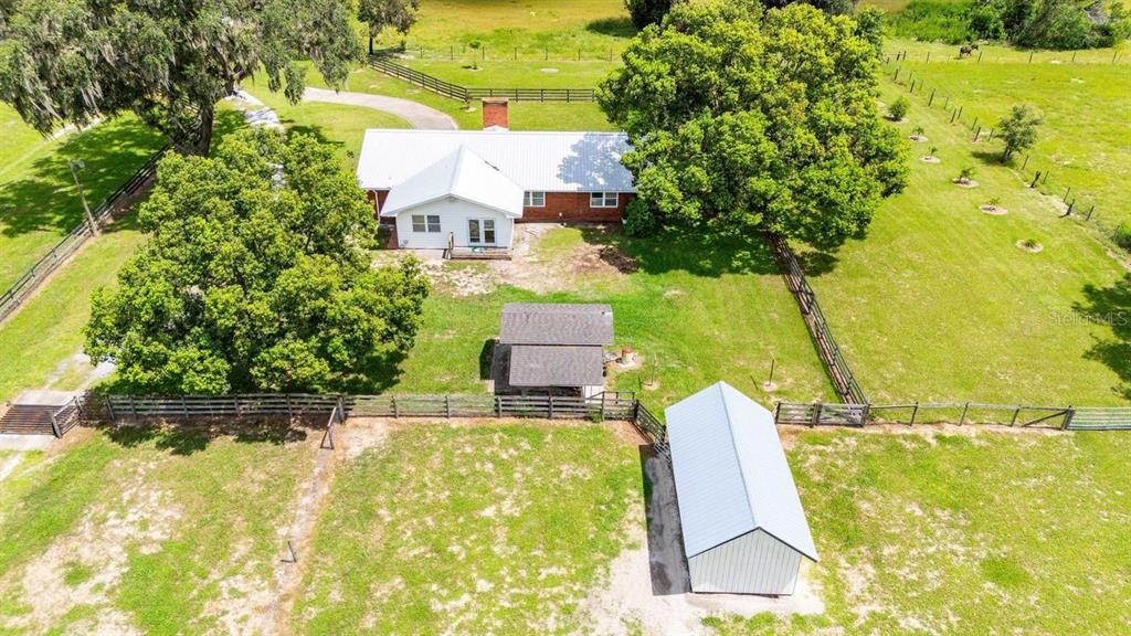 38730 Mickler Road Dade City, FL 33523 - Photo 28 of 38 an aerial view of residential house with pool and yard