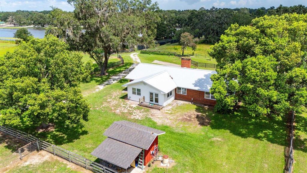 38730 Mickler Road Dade City, FL 33523 - Photo 30 of 38 an aerial view of a house with a yard basket ball court and outdoor seating
