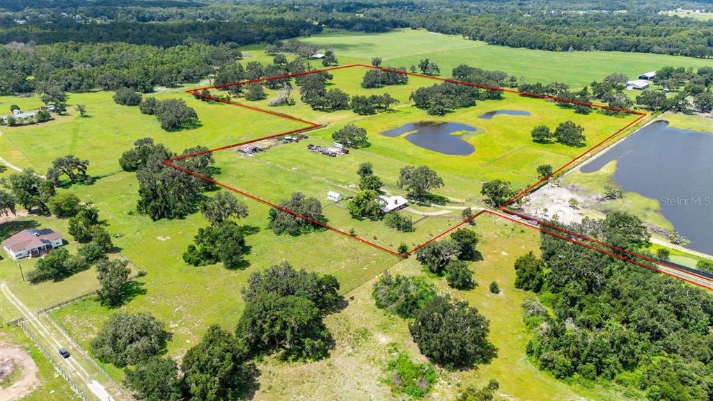 38730 Mickler Road Dade City, FL 33523 - Photo 31 of 38 an aerial view of residential houses with outdoor space
