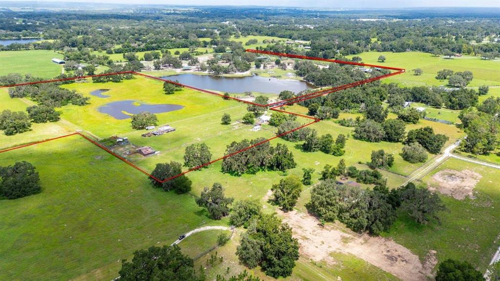 38730 Mickler Road Dade City, FL 33523 - Photo 33 of 38 an aerial view of residential houses with outdoor space